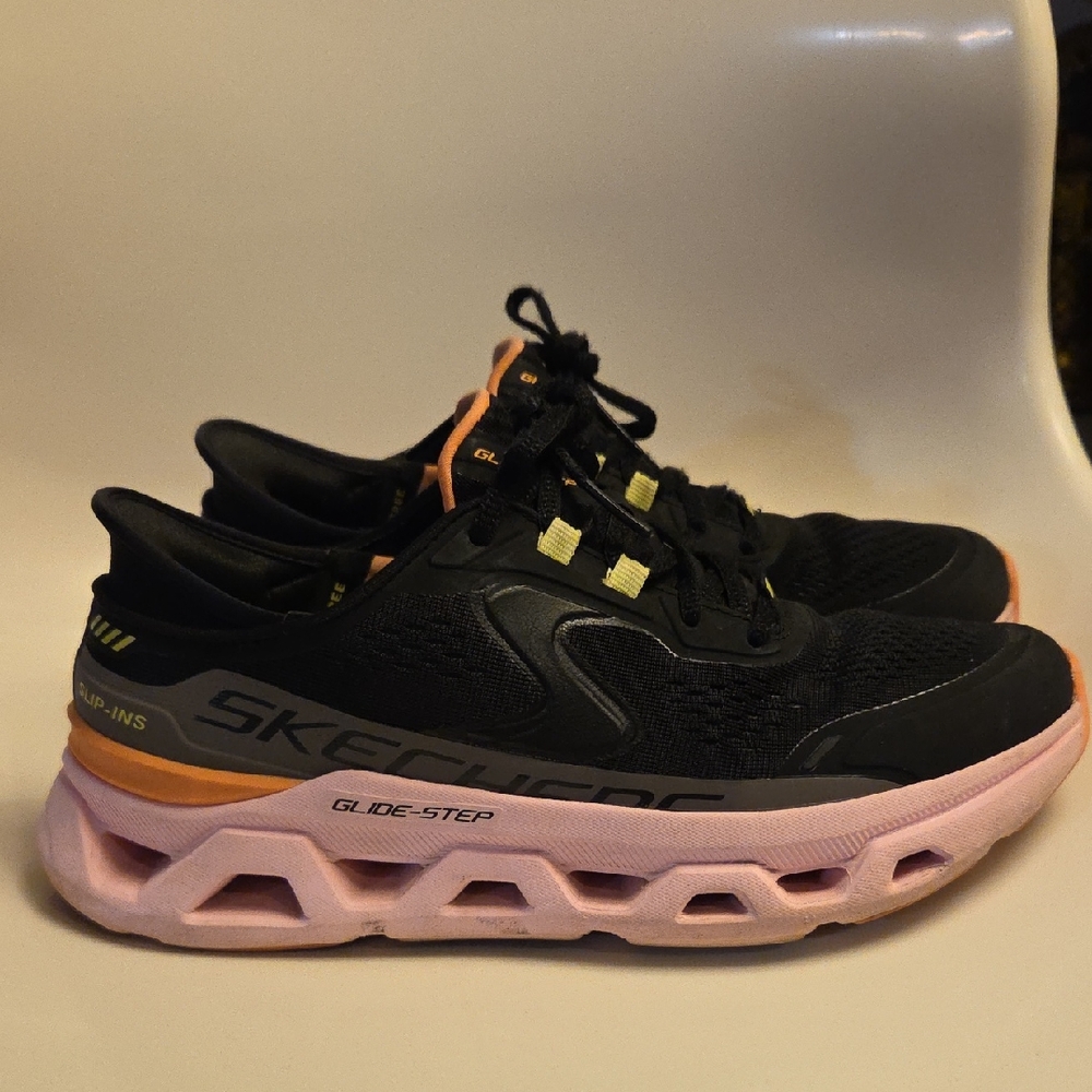 Skechers Women’s Black Athletic Sneakers with Pink Midsole and Orange Accents